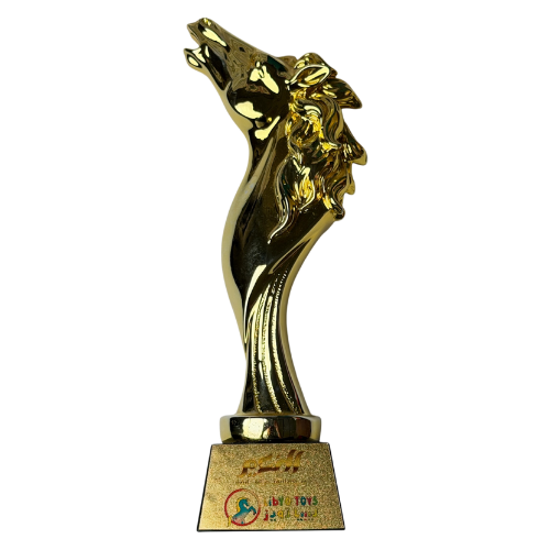 Golden horse-shaped recognition presented to Libya Toys in 2025